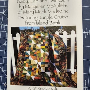 May include: A quilt pattern booklet featuring a colorful quilt with a jungle theme. The quilt is made with a variety of fabrics, including animal prints and geometric patterns. The booklet is titled "Jungle Jumble" and is a 10-inch stack quilt measuring 58 inches by 67 inches.