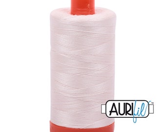 May include: A spool of white thread with an orange plastic bobbin and the text "AURIfil™" on the label.