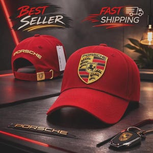 May include: Red baseball cap with the Porsche logo on the front and back. The cap features a curved brim and an adjustable strap. The image also includes a Porsche keychain and a metal emblem.
