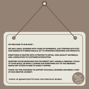 May include: A sign with the text "HI!! WELCOME TO OUR SHOP -" and other text. The sign is hanging from a brown background. The sign has the Simple Gift Studio logo in the bottom right corner.