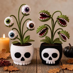 May include: Two crocheted potted plants. The left white pot features a skull design and holds three stalks with realistic eyeballs. The right black pot features a skull design and holds three green, toothy, carnivorous plant heads.