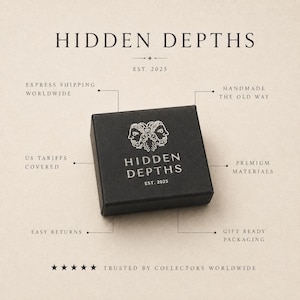 May include: A square black box with the white text HIDDEN DEPTHS and a logo featuring two faces. The box is surrounded by text labels including EST. 2025, HANDMADE THE OLD WAY, PREMIUM MATERIALS, GIFT READY PACKAGING, EASY RETURNS, US TARIFFS COVERED, and EXPRESS SHIPPING WORLDWIDE.