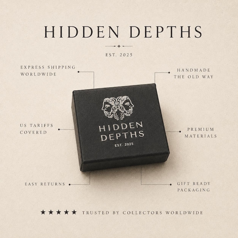 May include: A square black box with the white text HIDDEN DEPTHS and a logo featuring two faces. The box is surrounded by text labels including EST. 2025, HANDMADE THE OLD WAY, PREMIUM MATERIALS, GIFT READY PACKAGING, EASY RETURNS, US TARIFFS COVERED, and EXPRESS SHIPPING WORLDWIDE.