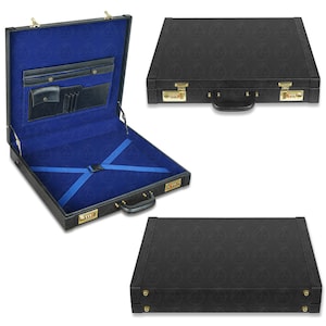 May include: A black hard-shell briefcase with a textured exterior and gold-tone combination locks. The interior is lined in bright blue fabric, featuring a black organiser panel with pockets, pen loops, and blue elastic cross-straps with a buckle.