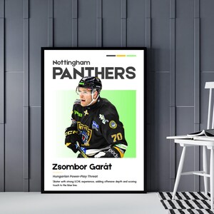 May include: A framed poster featuring a hockey player in a black and gold uniform with the number 70. The poster includes the text "Nottingham Panthers" and the player's name, Zsombor Gar&aacute;t. The background is a light green rectangle.