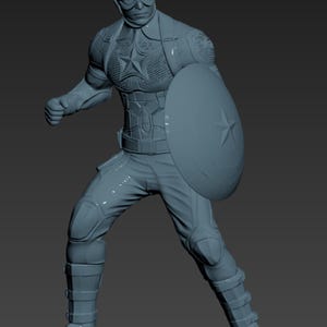May include: A gray figurine of Captain America in a dynamic pose, holding his iconic shield. The figure is detailed with a helmet, goggles, and a star emblem on the chest. The character is wearing a suit with protective gear.
