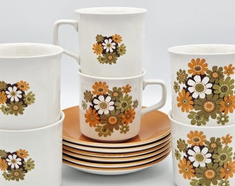 Juego de 12 tazas y platillos de té vintage con diseño floral naranja / Utensilios de cocina modernos de mediados de siglo