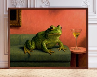 May include: A green frog sits on a green couch with a glass of liquid in a martini glass on a small table beside it. The background is a red wall.