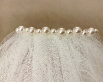 Add a single row of swarovski pearls to your veil - veil sold separately and flower not included