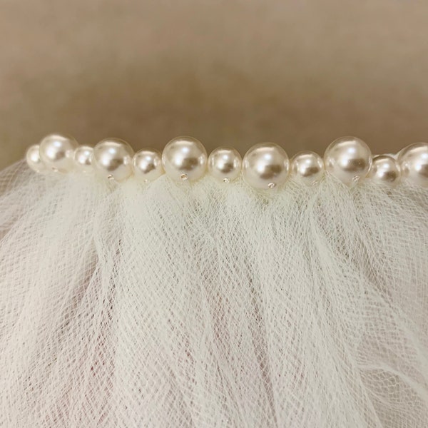 Add a single row of swarovski pearls to your veil - veil sold separately and flower not included