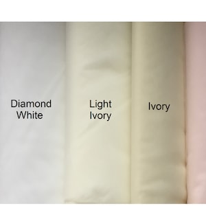 May include: Five fabric swatches in different shades of white and blush. The swatches are labeled "White", "Diamond White", "Light Ivory", "Ivory", and "Blush".