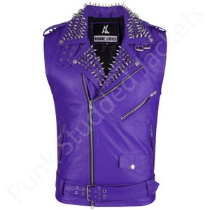 Mens purple punk leather vest with studded spiked biker design, gothic rocker sleeveless jacket style for festivals, concerts, and motorcycle riding. This heavy metal rocker vest doubles as clubwear punk biker vest and alternative style outfit. Bold purple motorcycle jacket color with gothic punk spiked details, sleeveless punk biker top cut, and rocker studded biker top finish make it perfect men’s punk festival vest and fashion statement.