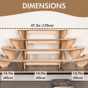 May include: A light-coloured wooden tiered display stand with four levels. The structure measures 120 cm in total width and 40 cm in total height. Each of the three base sections measures 40 cm in width, featuring a curved design for the display shelves.