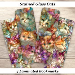 May include: Four laminated bookmarks featuring stained glass cat designs. The bookmarks showcase colorful cat portraits in shades of orange, purple, blue, and pink, with gold-colored outlines. The text "Stained Glass Cats" and "4 Laminated Bookmarks" are visible.