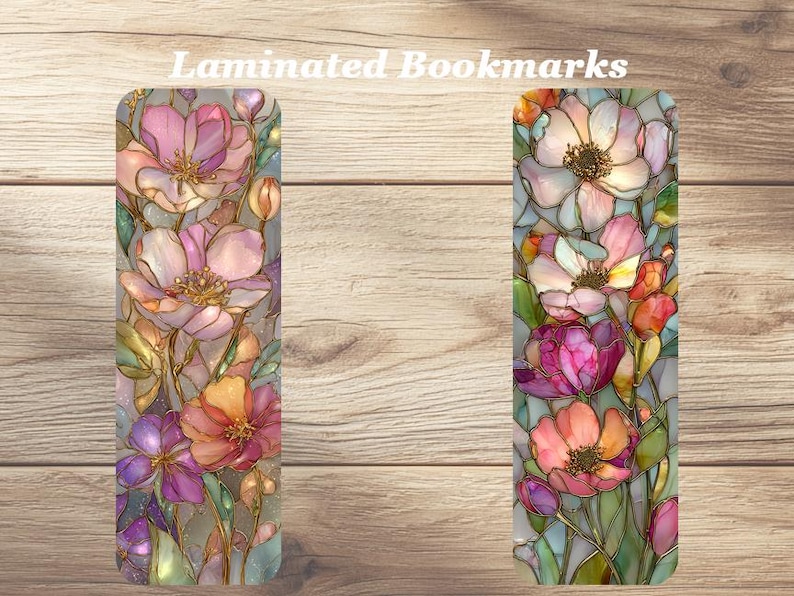 May include: Two laminated bookmarks with floral designs. The bookmarks feature colorful flowers in shades of pink, orange, and purple, with green leaves and stems. The text "Laminated Bookmarks" is at the top.
