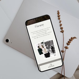 May include: A smartphone displays a wedding story with the title "Our Story" and two black and white photos. The phone rests on a silver tablet and is accompanied by dried lavender sprigs. The bottom of the phone reads "The schedule."