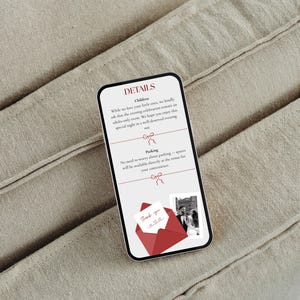 May include: A smartphone displaying wedding details against a neutral fabric backdrop. The screen shows text about children and parking, along with a red envelope graphic and a photo. The phone's screen is white with black text.