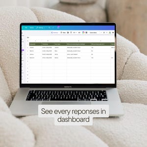 May include: A silver MacBook Pro laptop displaying a spreadsheet with data, resting on a cream-colored, textured surface. The screen shows a table with columns and rows of data. The text at the bottom reads: "See every reponses in dashboard."