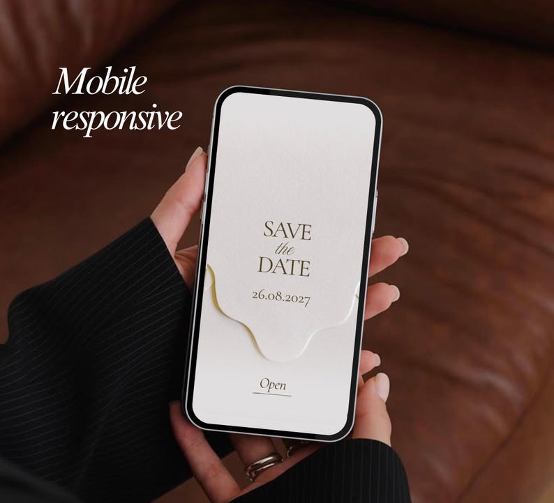 May include: A smartphone displaying a digital Save the Date invitation on its screen. The screen shows the text Save the Date, the date 26.08.2027, and an Open button. The text Mobile responsive is visible in the upper left corner of the image.