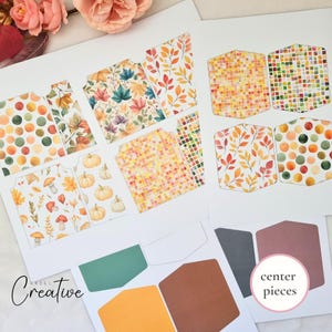 May include: A collection of printed paper envelope templates with various autumn-themed designs. The designs include watercolor leaves, pumpkins, and mosaic patterns in shades of orange, yellow, and green. The text "center pieces" is visible on a pink circle.