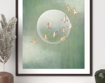 May include: A framed art print featuring a flock of birds in flight against a soft green and white background. The birds are depicted in a minimalist style, with a large, glowing white circle in the center. The artwork is framed in a dark brown frame.