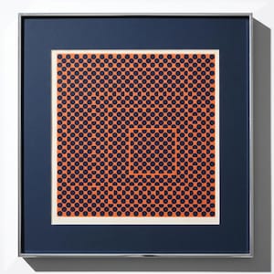 May include: Framed abstract art print featuring a pattern of navy blue semi-circles on an orange background. The artwork is framed in a silver metal frame with a navy blue mat.