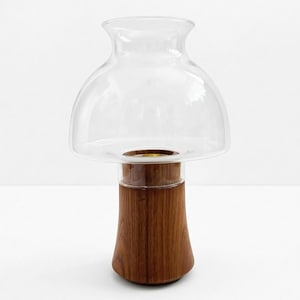 May include: A rustic wooden sign with the text "Welcome to our home" in white lettering. The sign features a distressed finish and a simple, inviting design, perfect for entryway decor.