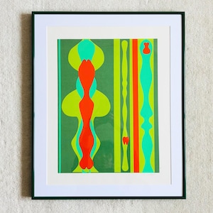 May include: A framed abstract art print with a green border. The artwork features a green background with vertical stripes and colorful shapes in orange, yellow-green, and light green. The print is displayed on a white textured surface.