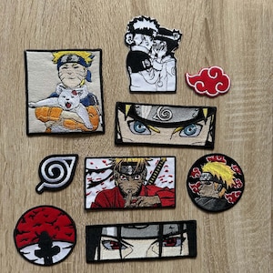 May include: A collection of nine embroidered patches featuring anime characters and symbols. Designs include Naruto Uzumaki with a cat, a couple, a red cloud, close-ups of eyes, a leaf symbol, and a character performing a hand sign.