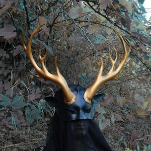 Scythian deer goddess, Siberian elk in gold and black leather mask