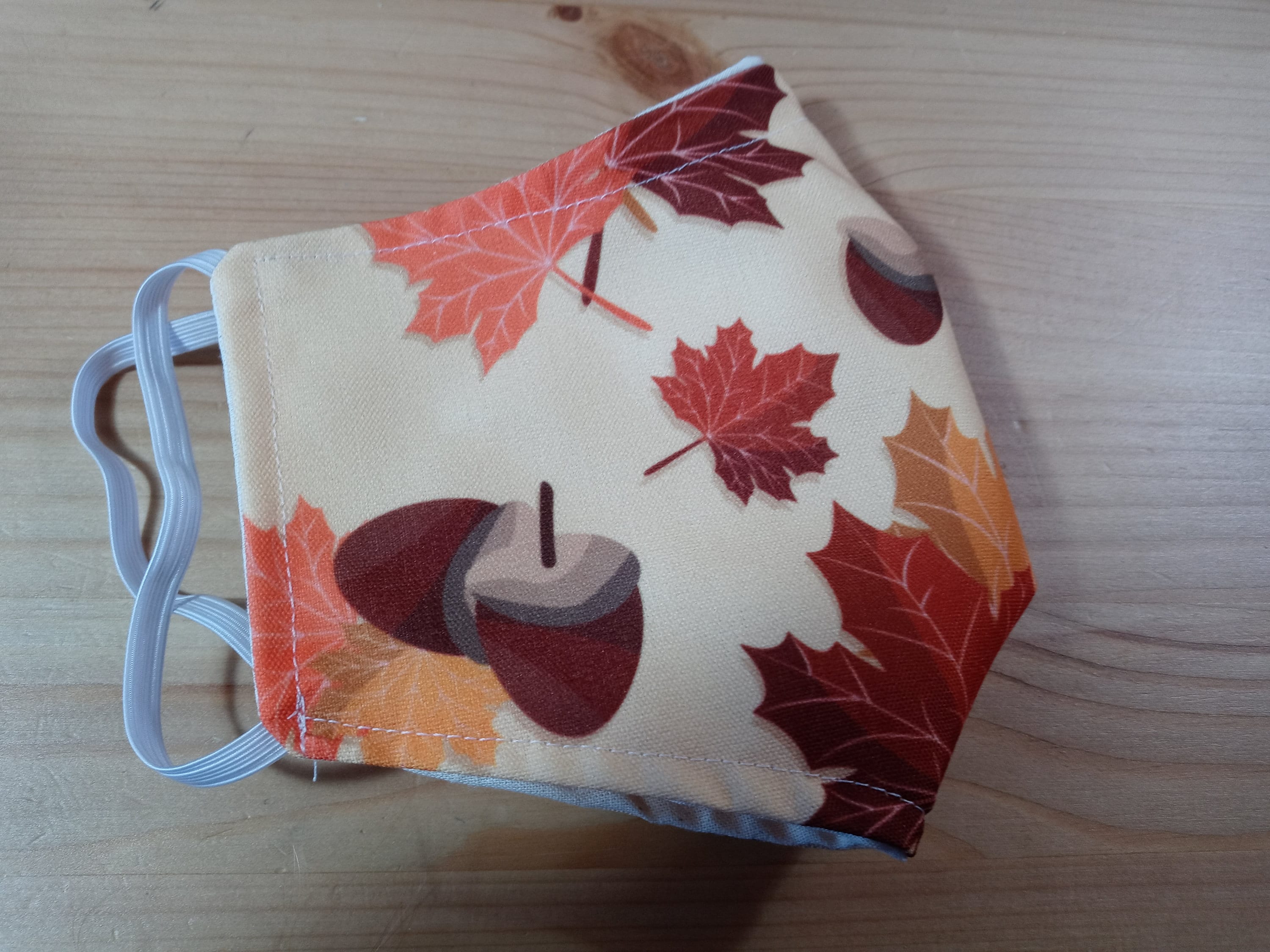 Fall Face Mask with Side Opening for Filters.  This Autumn Leaves with Acorns Face Covering Includes 5 PM 2.5 filters. Orange, Beige, Brown - Thumbnail 2
