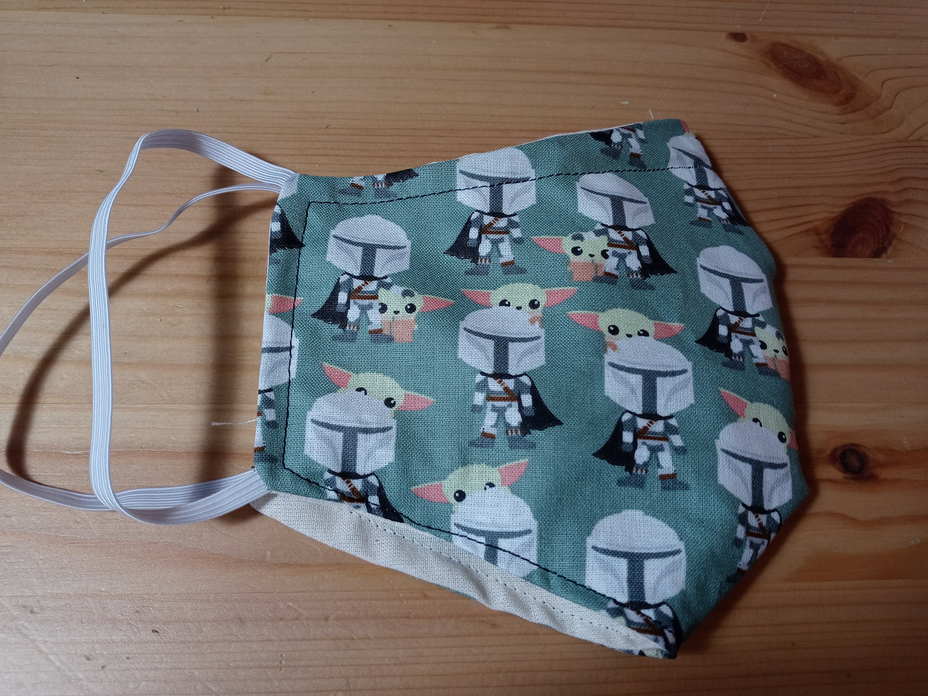 The Mandolorian and the Child Face Mask with side opening for filters.  This Star Wars Face Covering comes with 5 2.5 PM Filters. - Thumbnail 2