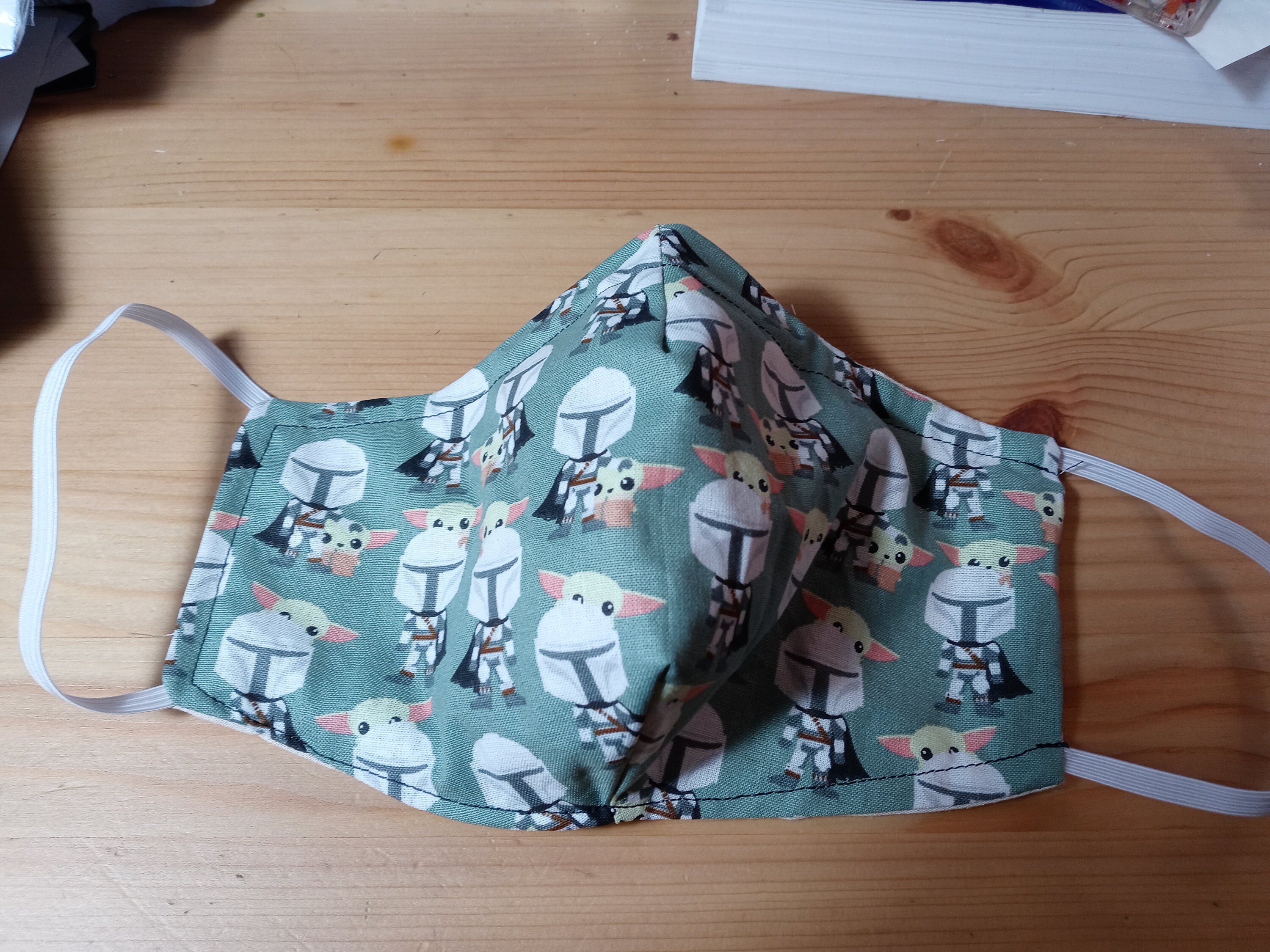 The Mandolorian and the Child Face Mask with side opening for filters.  This Star Wars Face Covering comes with 5 2.5 PM Filters.