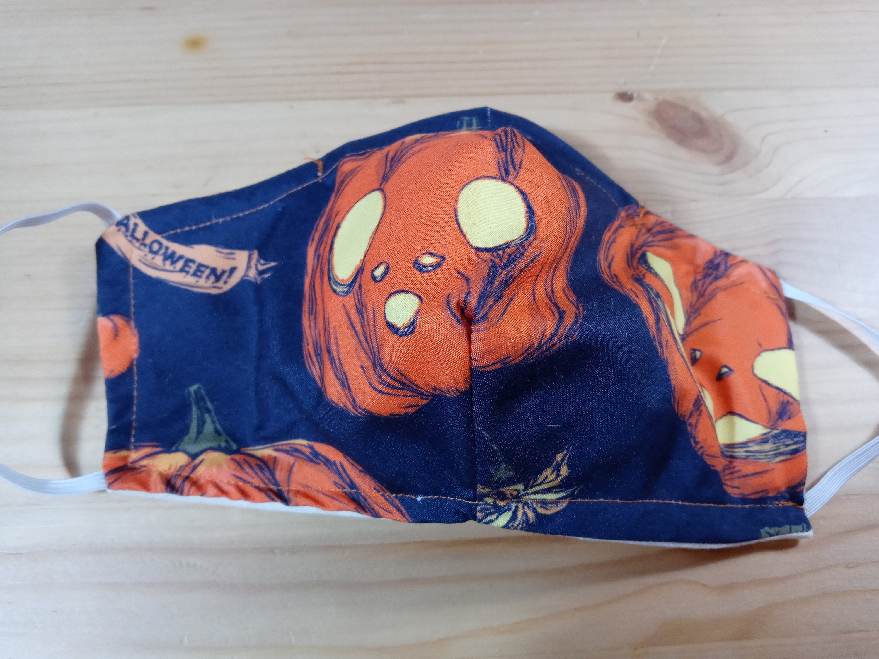 Halloween Pumpkin Face Mask With Side Opening for Filters. This Spooky Mask Includes 5 PM 2.5 filters. This is for Kids and Adults