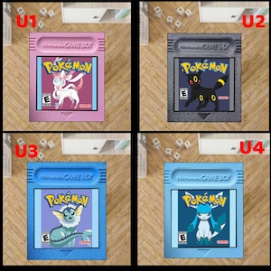 May include: Four Nintendo Game Boy cartridges featuring Pok&eacute;mon characters. Each cartridge has a different color: pink, gray, blue, and light blue. The Pok&eacute;mon logo and a specific character are displayed on each cartridge.
