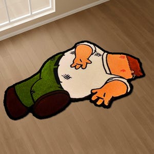 Könnte beinhalten: Ein Teppich in Form einer Cartoonfigur mit weißem Oberteil, grüner Hose und orangefarbener Haut. Der Teppich hat schwarze Konturen und liegt auf einem Holzboden. Das Design ist eine Cartoonfigur.
