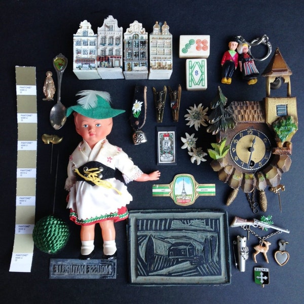 The Alpine Souvenir collection of red green and a little white mismatched treasures. Travelers instant collection of found object and things