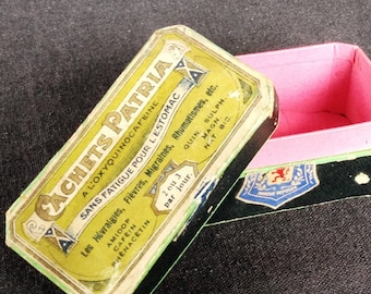 Vintage cardboard apothecary green pink pill box. Medicine pharmacy oddities for medical collectors. Fever headache rheumatism antique cure