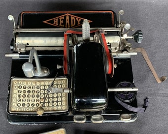Antique embossing collectibles toy typewriter. Vintage writing portable tool. Office display prop setting collector.