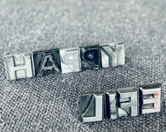 HAPPY LIFE. Vintage letterpress printing blocks word spelling. Printer retro supply. Mixed media and shadow boxes fun supply findings.