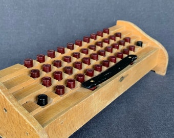 Retro wood typewriter practicing keyboard. Vintage typing dactylography learning tool. Office desk curiosity cabinet decor supply.