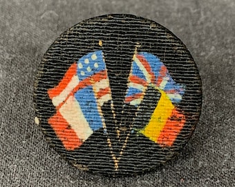 Vintage militaria commemorative four flags button finding. International World War souvenir embellishment. United Nations military memento.