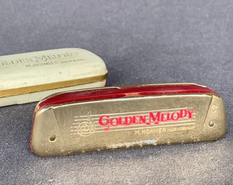 Vintage Hohner petit Harmonica Golden Melody. Instrument de poche miniature à collectionner. Musique fabriquée en Allemagne