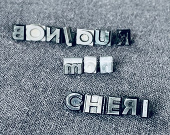 Hello Darling. Vintage French letterpress printing cast letters word spelling. Bonjour mon chéri love message statement made in France