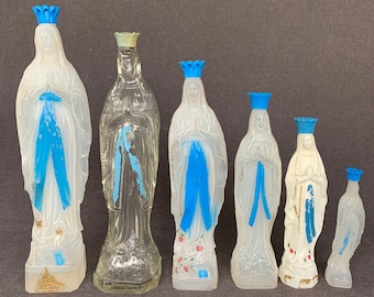 The French holy water Virgins bottle instant collection of six. Kitsch souvenir from a religious pilgrimage to Lourdes in France.