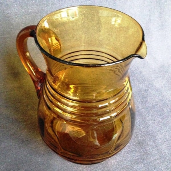Golden brown vintage glass pitcher. Retro fall, autumn party or Christmas decoration table setting idea. Gift for host or hostess too