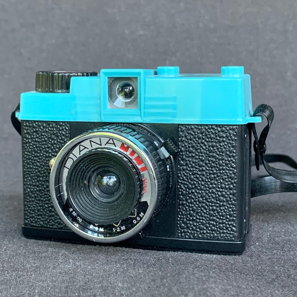 Vintage retro miniature Diana-F camera. Picture taking photographer collectible supply tool. Film 120 photography collector material.