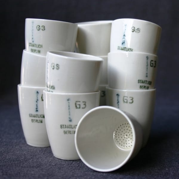Laboratory dishes. Series of mini porcelain cups.