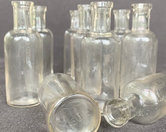 Vintage laboratory glass bottles magical potion. Rescued kitchen pharmacist druggist curiosity cabinet vial supply. Favor vase party decor