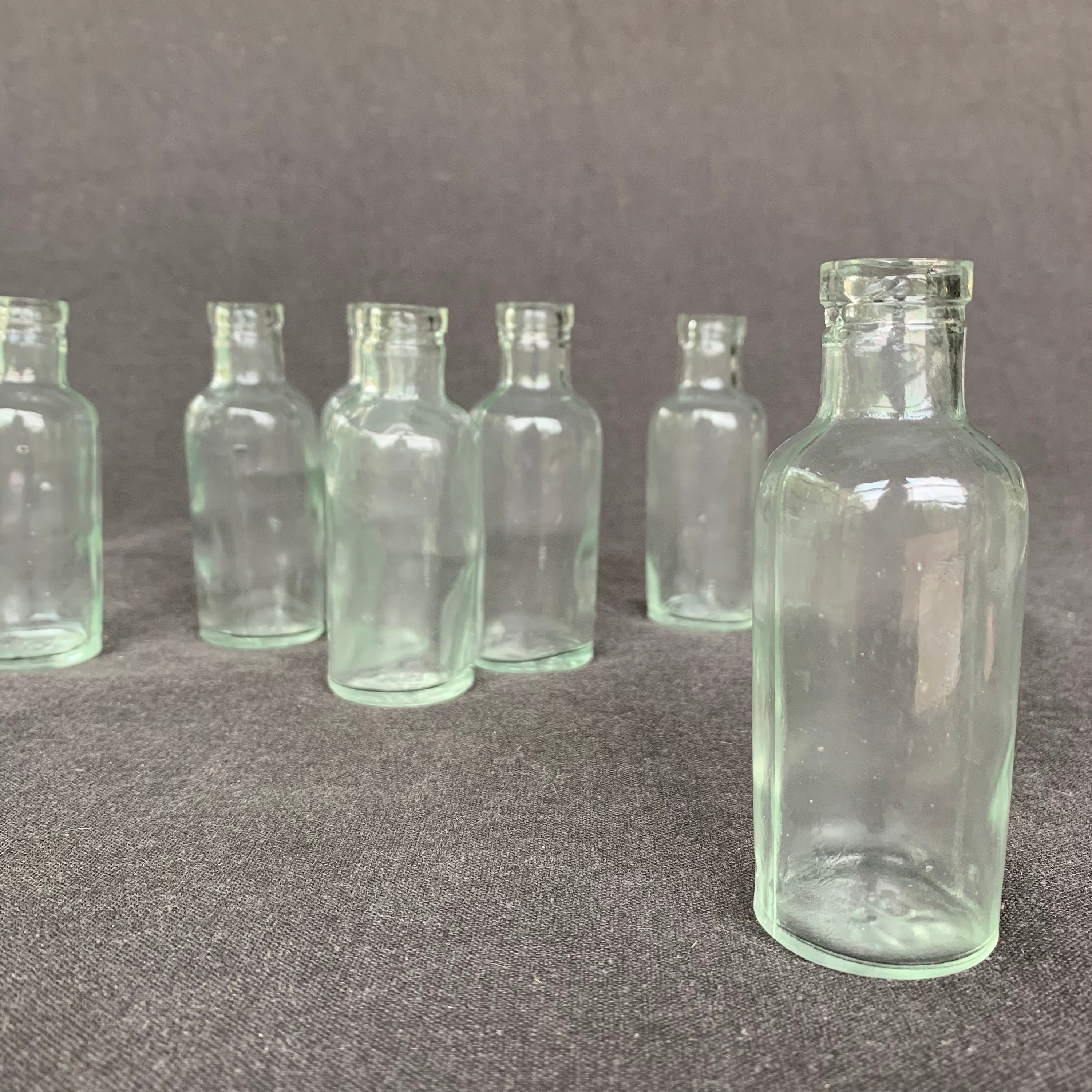 Vintage laboratory glass bottles magical potion. Rescued kitchen pharmacist druggist curiosity cabinet vial supply. Favor vase party decor